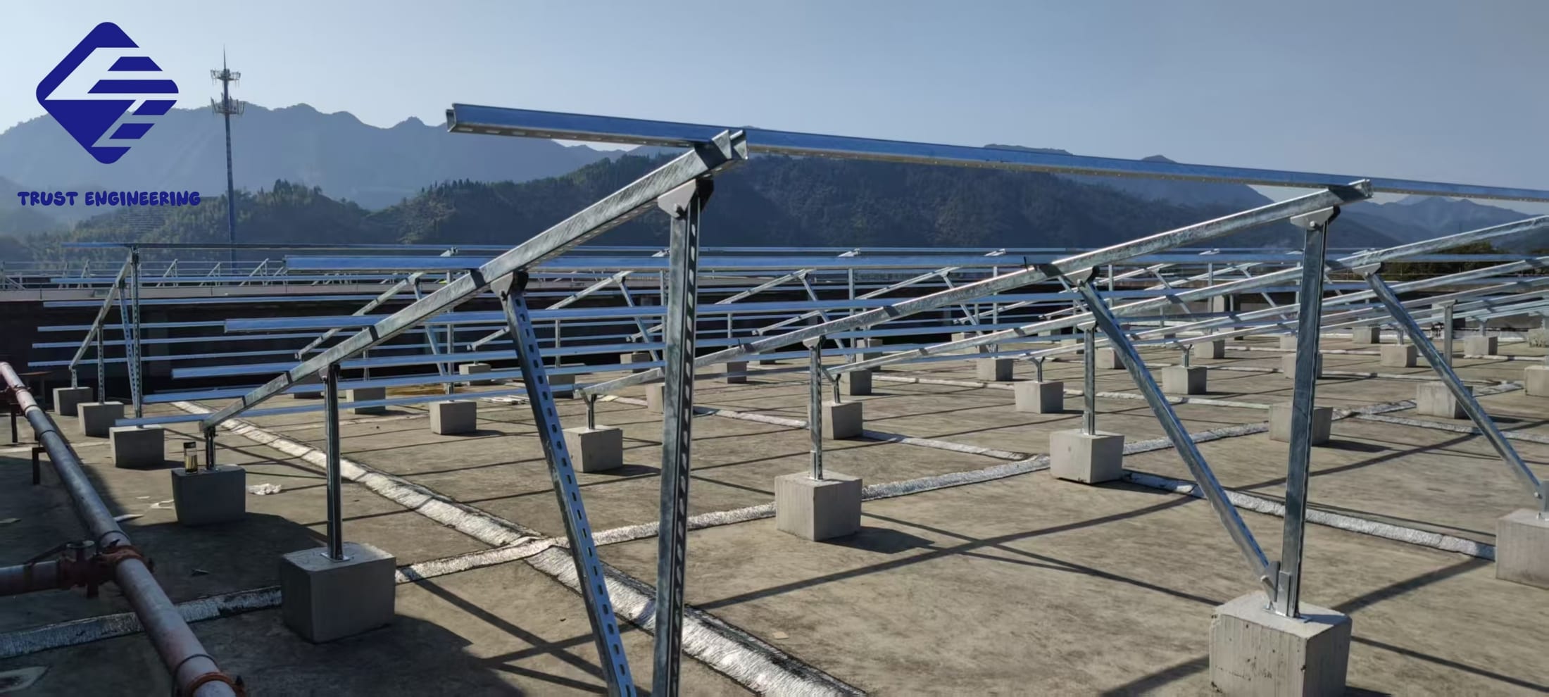 Steel ground mounting bracket with concrete foundation